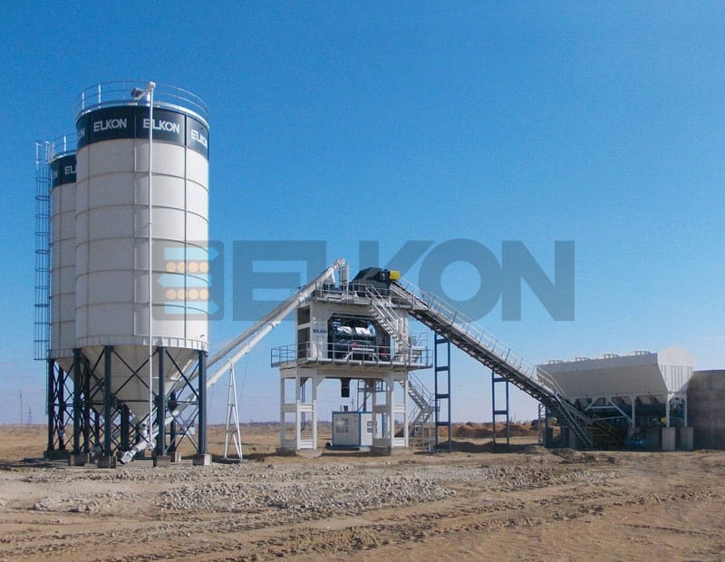 Concrete batching plant with storage silos on site.