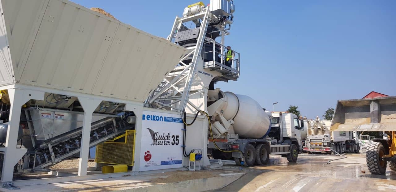 Concrete mixer truck at construction site.