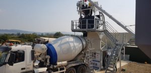 Concrete mixer truck at construction site landscape