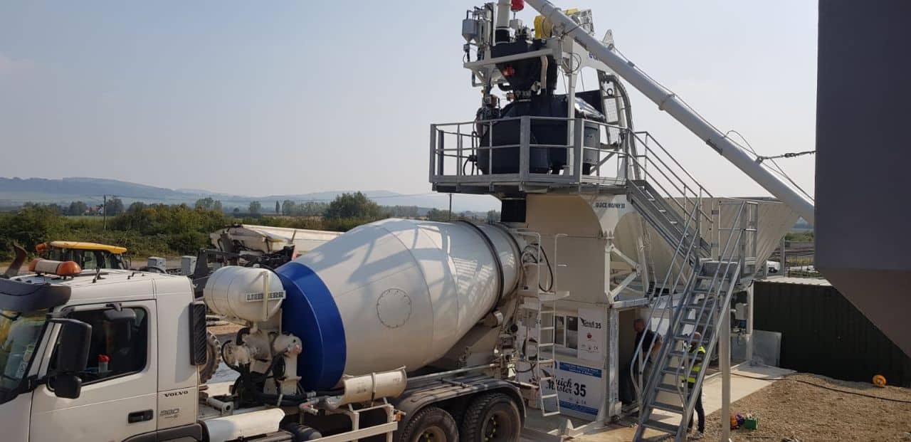 Concrete mixer truck at construction site landscape