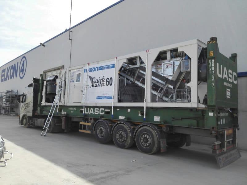 Concrete batching plant on a truck at warehouse.