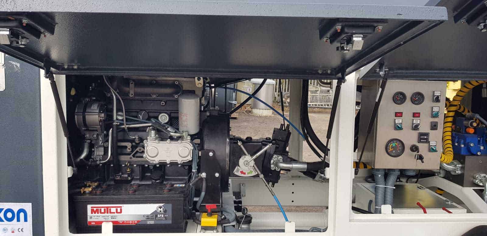 Industrial engine and control panel inside machinery