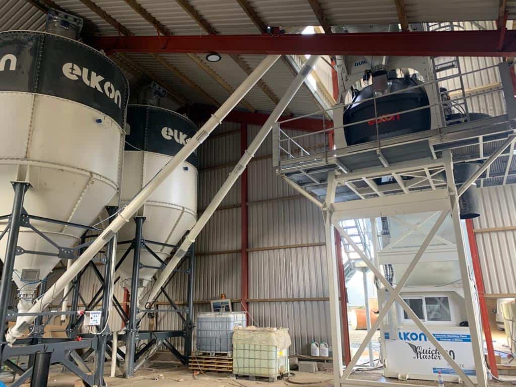 Industrial cement mixing silos in warehouse