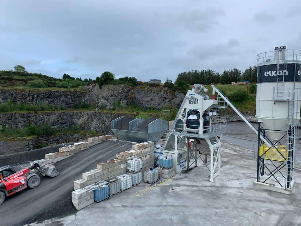 Concrete plant in a quarry setting.