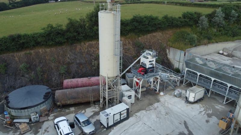 Aerial view of industrial cement plant and machinery.